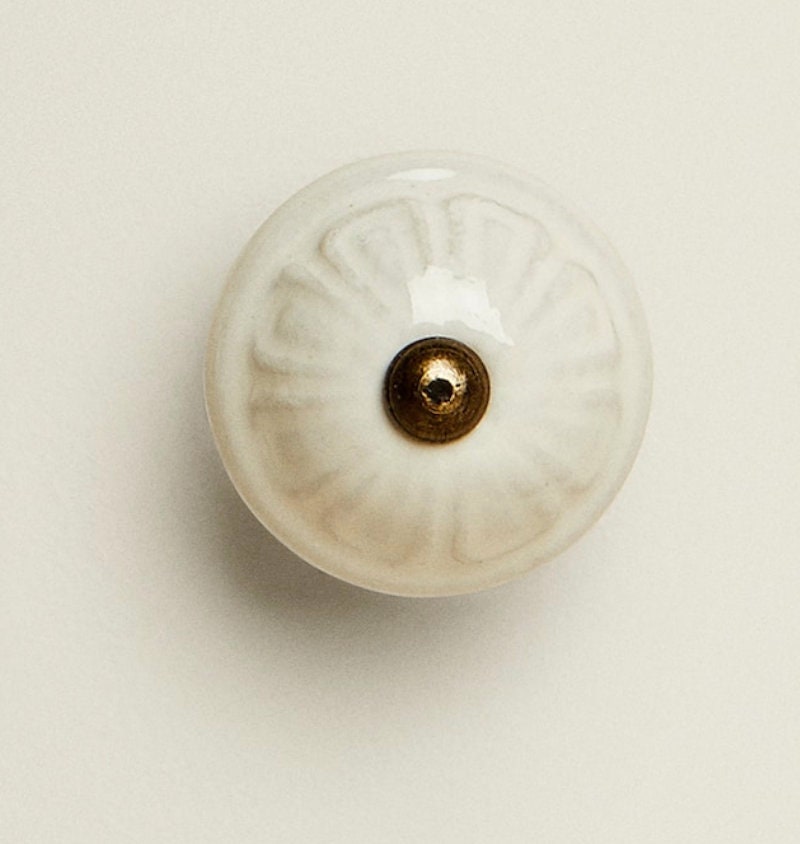 Ceramic Rounded Cream Flower Knob with a Antique Aged Metal Center